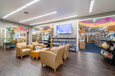 Photo of library showing comfortable chairs and bookshelves