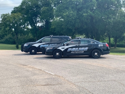 Photo of black police cars that say Hutchins on the side