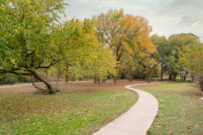 Photo of walking trail and trees at Sunrise Creek Park during the fall